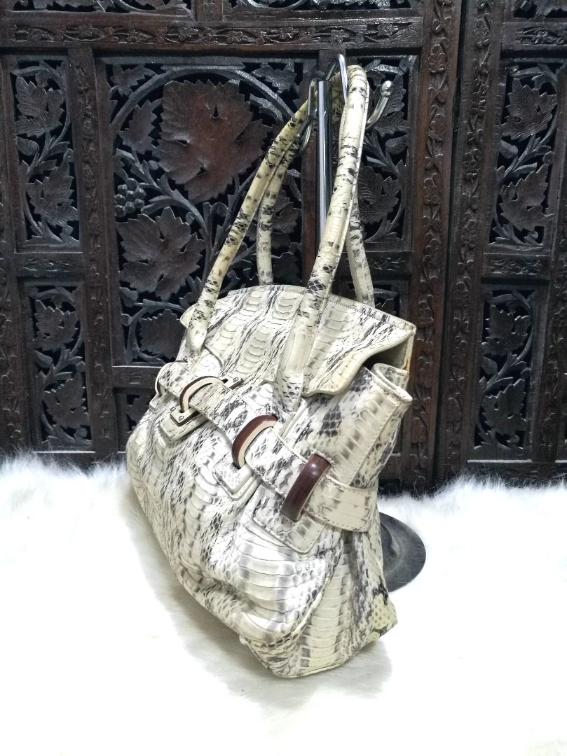 Ferragamo White Python Apollonia Bag (Category: Shoulder Bags) located in Quezon City. Submitted by katebutters (Listing ID 1407817984, Image 3). Description: Authentic Salvatorre Ferragamo Python Apollonia Bag with ivory and multicolor python with silver-tone hardware, dual rolled top handles, buckle adornments featuring wooden accents at exterior, taupe and multicolor jacquard woven lining, three pockets at interior wall; one with zip closure a