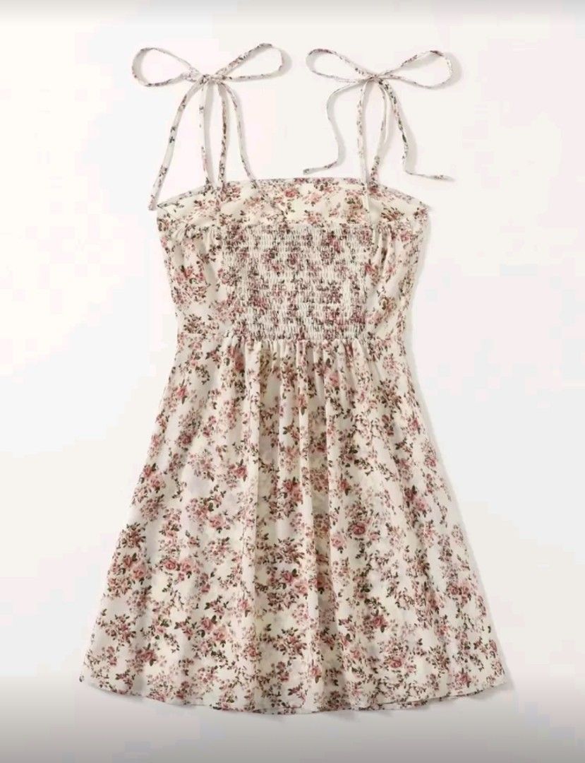 Floral Mini Dress with Tie Straps (Category: Dresses) located in Quezon City. Submitted by randomz029 (Listing ID 1407876594, Image 2). Description: - Floral print mini dress - Features tie straps - Square neckline - Fitted bodice - Slightly flared skirt - Ideal for casual and summer events - Made of lightweight fabric.