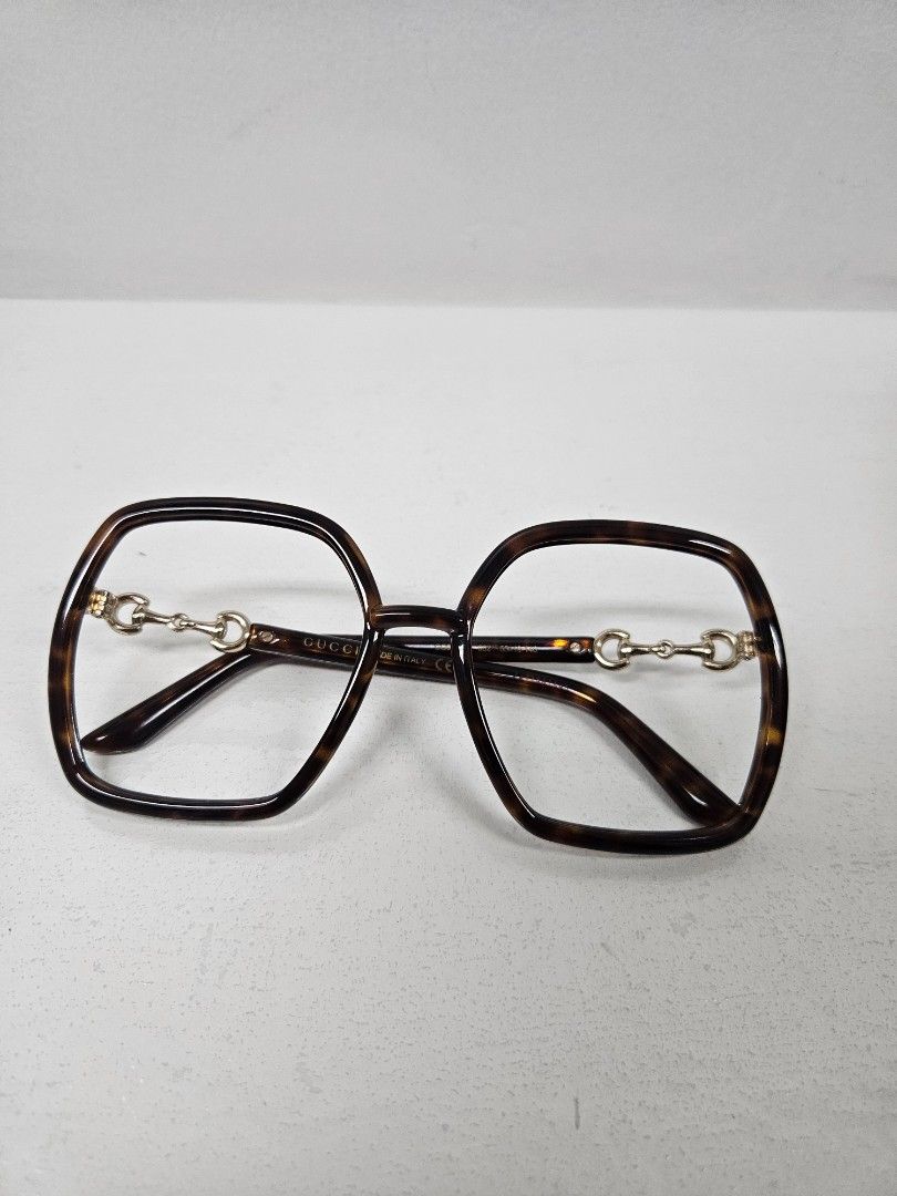 Gucci Frames (GG890S) (Category: Sunglasses & Eyewear) located in Pasig City. Submitted by simdeclutters (Listing ID 1407895511, Image 3). Description: Square frame No lens Tortoise shell Includes navy blue Gucci pouch.