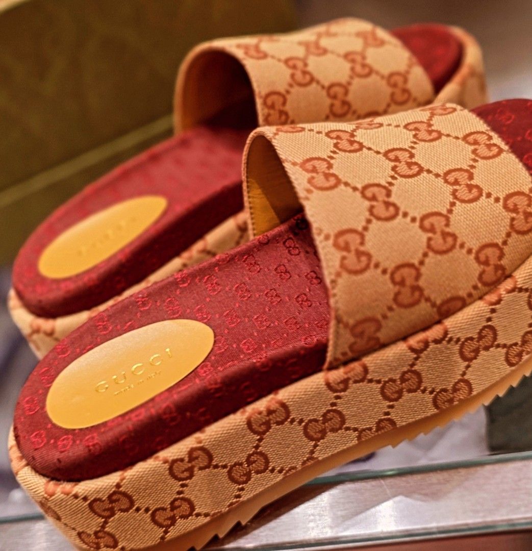 Gucci GG Canvas Platform Slides (Category: Sneakers & Footwear) located in Batangas. Submitted by damirez88 (Listing ID 1407901447, Image 1). Description: - Authentic Gucci slides - Iconic GG canvas design - Platform sole - Red insole - Gucci logo visible - Perfect for everyday luxury.