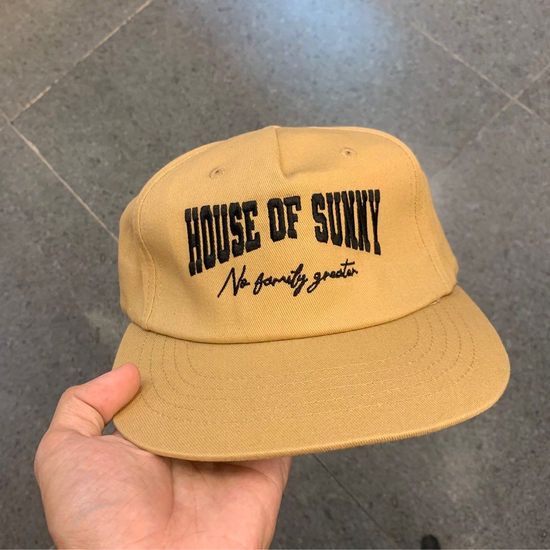 House of Sunny Cap (Category: Caps & Hats) located in Pasig City. Submitted by paymelikelandlord (Listing ID 1407913843, Image 2). Description: - House of Sunny tan cap - Features brand name and "No family greater" embroidery - Classic six-panel design - Flat brim - Stylish accessory.