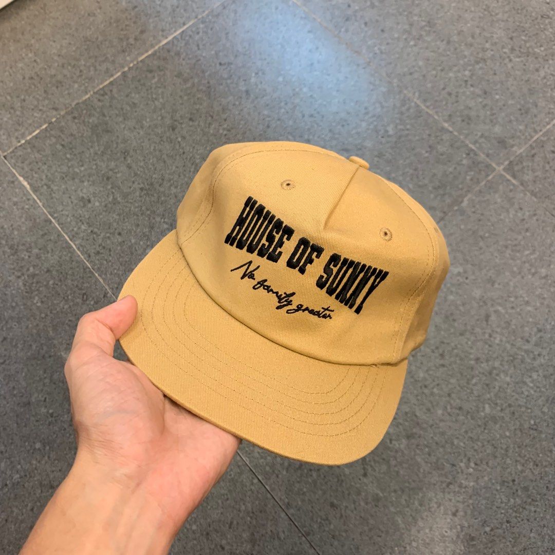 House of Sunny Cap (Category: Caps & Hats) located in Pasig City. Submitted by paymelikelandlord (Listing ID 1407913843, Image 3). Description: - House of Sunny tan cap - Features brand name and "No family greater" embroidery - Classic six-panel design - Flat brim - Stylish accessory.