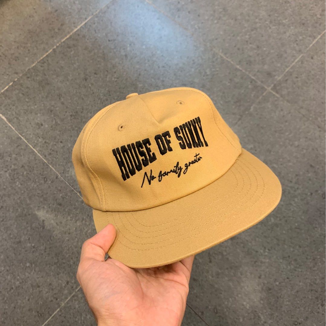 House of Sunny Cap (Category: Caps & Hats) located in Pasig City. Submitted by paymelikelandlord (Listing ID 1407913843, Image 1). Description: - House of Sunny tan cap - Features brand name and "No family greater" embroidery - Classic six-panel design - Flat brim - Stylish accessory.