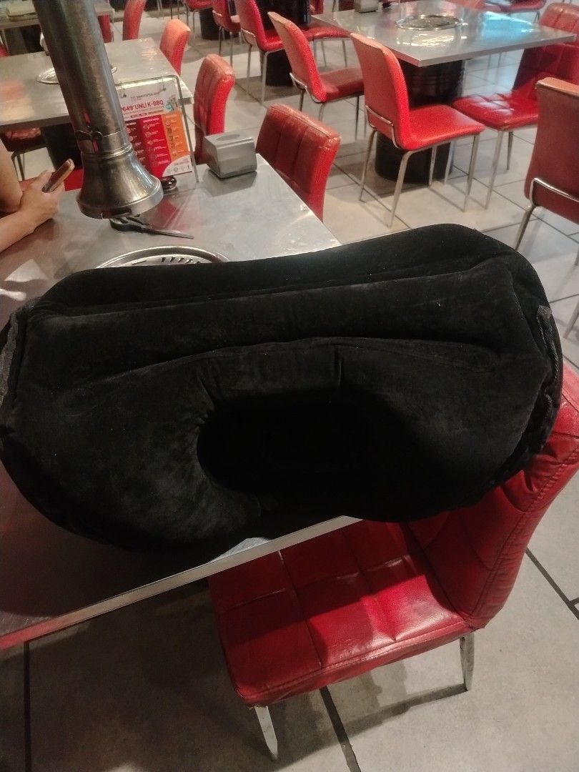 Inflatable Travel Pillow (Category: Travel Essentials & Accessories) located in Manila. Submitted by cybondelga33898 (Listing ID 1407874562, Image 2). Description: - Inflatable travel pillow for ultimate comfort. - Unique design with a face hole for head and neck support. - Made of soft, black material. - Portable and easy to inflate and deflate. - Ideal for airplanes and all types of travel..