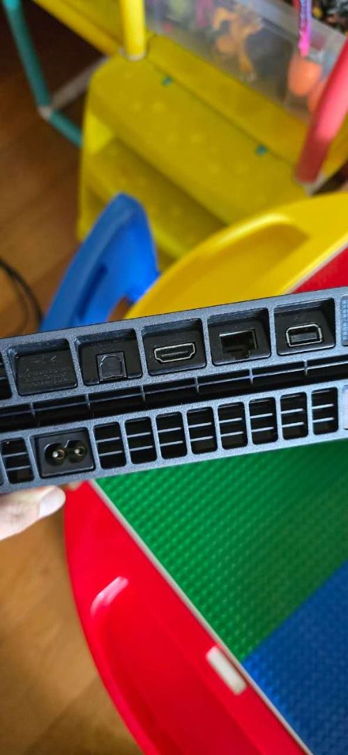 PlayStation 4 Console+ Games (Category: PlayStation) located in Makati City. Submitted by wesley.phvan (Listing ID 1407776249, Image 3). Description: Includes a PlayStation 4 console, and several PS4 game discs. Games include Tomb Raider, God of War, and more. The console has various ports, including HDMI and USB..