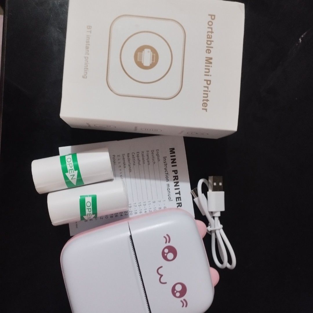 Mini Portable Wireless Bluetooth Thermal Photo Pocket Printer (Category: Printers, Scanners & Copiers) located in Tarlac. Submitted by zy.aniks (Listing ID 1406279660, Image 3). Description: What’s Included: ҂ Box ҂ (2) Sticker Papers + (1) Plain Paper ҂ Type-C Charging Cable ҂ Instruction Manual Perfect for: 📝 Notes, To-Do Lists, Receipts, & Waybill 📸 Photos & Creative Prints 🎨 Journaling, Scrapbooks, Labels, and More!.