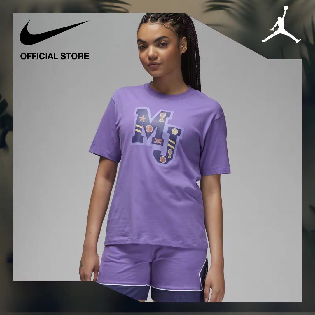 Nike Jordan MJ T-Shirt (Category: Tshirts & Polo Shirts ) located in Mandaluyong City. Submitted by annezoe (Listing ID 1407920641, Image 1). Description: - Nike Jordan T-shirt - Purple color - Features "MJ" graphic on front - Crew neck design - Short sleeves - Nike logo on top left - Likely part of a set (shorts not included).
