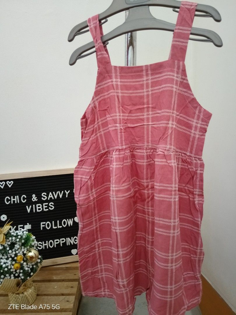 Pambahay Dress (2-3Y) (Category: Babies & Kids Fashion) located in Binan City. Submitted by criscb (Listing ID 1407852079, Image 1). Description: Pink plaid dress with square neckline and wide straps. The second image shows a solid red dress with the same style. The third image shows a pink dress with tie straps and a tiered skirt. #kidsdress #pambahaydress #kidspambahay #chicsavvyvibes #pinkdress #kidsootd.