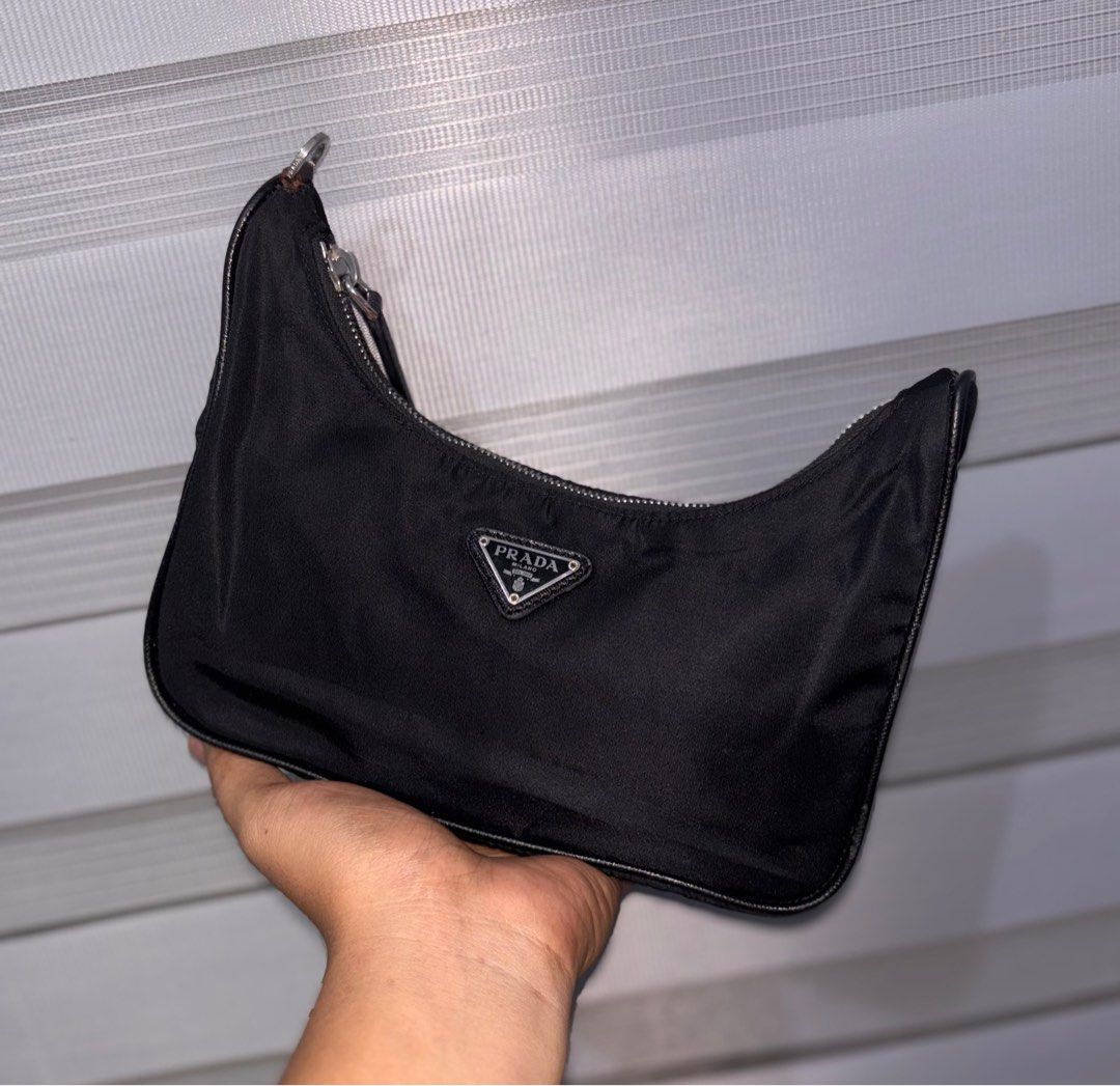 Prada Black Nylon Hobo Bag (Category: Luxury Bags & Wallets) located in Bago City. Submitted by christiaaan0515 (Listing ID 1407804009, Image 1). Description: PRADA KILI BAG AUTHENTIC IN EXCELLENT CONDITION MISSING HANDLE NO OTHER ISSUE .