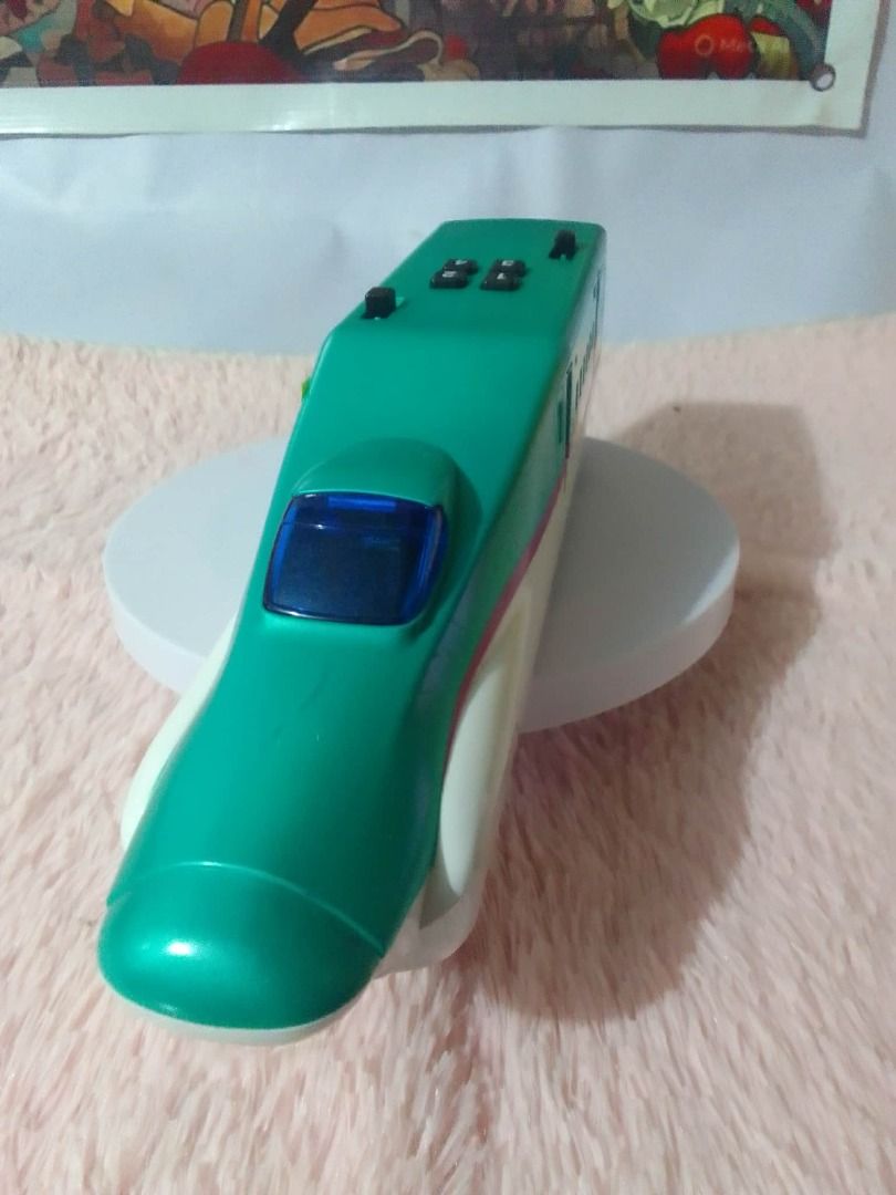 Shinkansen Bullet Train Toy (Category: Vehicle & Diecast Models) located in Tanza. Submitted by leonskidskorner (Listing ID 1407862450, Image 2). Description: - Sleek green and white design - Detailed exterior with windows - Modeled after a Shinkansen bullet train - Perfect for toy train collectors.
