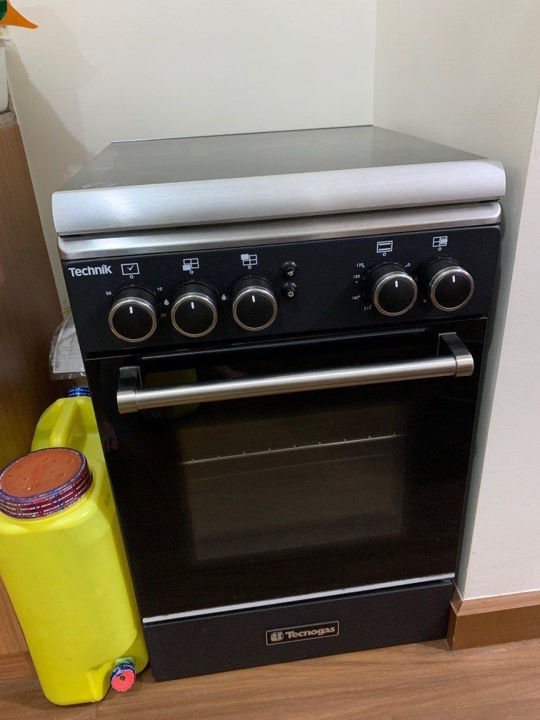 Tecnogas Oven with 3-Burner Gas Range (Category: Cookers) located in Pasay City. Submitted by jnjnin (Listing ID 1407887661, Image 1). Description: Tecnogas oven bought for around ₱25,000. Gas oven used only THREE TIMES. Cleaned and no damages. Still comes with the manual. RFS: Moving to a small condo unit where no gas cooking is allowed. - Tecnogas 3-burner gas range - Stainless steel cooktop - Black oven door with handle - Includes control knob