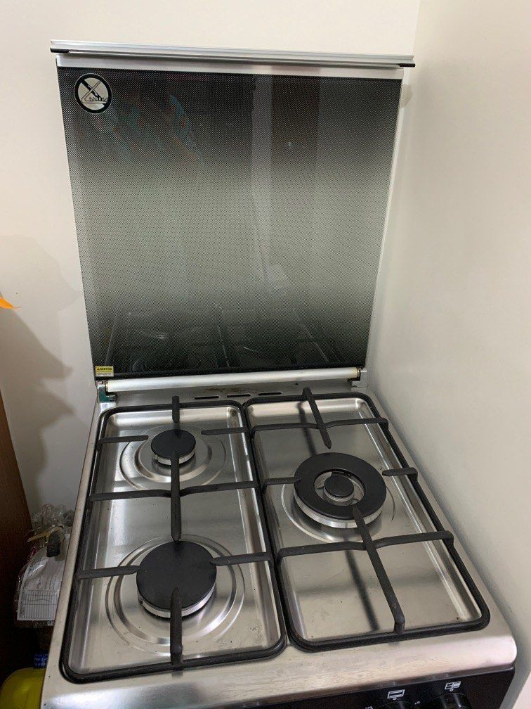 Tecnogas Oven with 3-Burner Gas Range (Category: Cookers) located in Pasay City. Submitted by jnjnin (Listing ID 1407887661, Image 2). Description: Tecnogas oven bought for around ₱25,000. Gas oven used only THREE TIMES. Cleaned and no damages. Still comes with the manual. RFS: Moving to a small condo unit where no gas cooking is allowed. - Tecnogas 3-burner gas range - Stainless steel cooktop - Black oven door with handle - Includes control knob