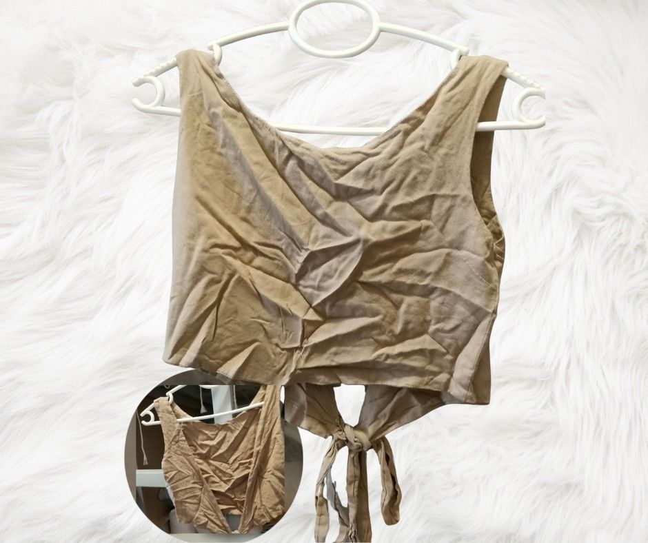 Tie-Back Crop Top (Category: Sleeveless) located in Manila. Submitted by thatstyle (Listing ID 1407834662, Image 1). Description: - Beige crop top - Tie-back design - Scoop neckline - Sleeveless - Lightweight fabric - Versatile for any occasion.