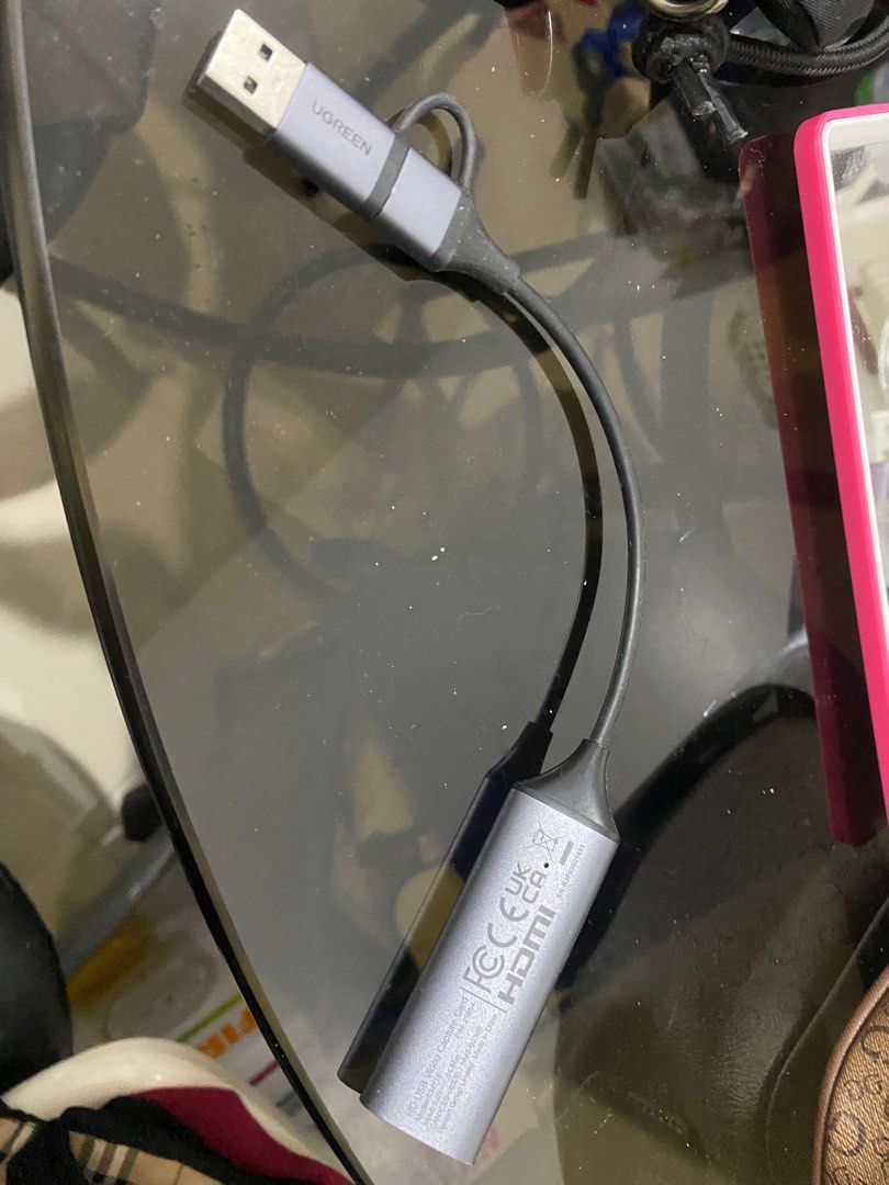 Ugreen USB to HDMI Adapter (Category: Cables & Adaptors) located in Las Pinas. Submitted by trisdanchase (Listing ID 1407870348, Image 1). Description: SELLING FOR 700 RFS: NOT BEING USED ANYMORE QUALITY LIKE NEW - Ugreen USB to HDMI adapter. - Features a USB connector and an HDMI port. - Stylish gray and black color scheme. - Ugreen logo present. - HDMI port with markings. DM FOR QUESTIONS CAN BE USED ON IPAD AND OTHER MONITORS.
