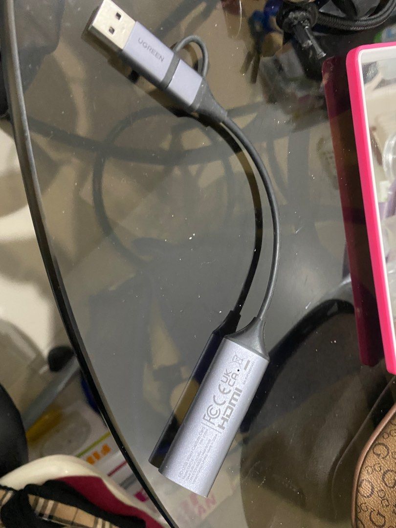 Ugreen USB to HDMI Adapter (Category: Cables & Adaptors) located in Las Pinas. Submitted by trisdanchase (Listing ID 1407870348, Image 2). Description: SELLING FOR 700 RFS: NOT BEING USED ANYMORE QUALITY LIKE NEW - Ugreen USB to HDMI adapter. - Features a USB connector and an HDMI port. - Stylish gray and black color scheme. - Ugreen logo present. - HDMI port with markings. DM FOR QUESTIONS CAN BE USED ON IPAD AND OTHER MONITORS.