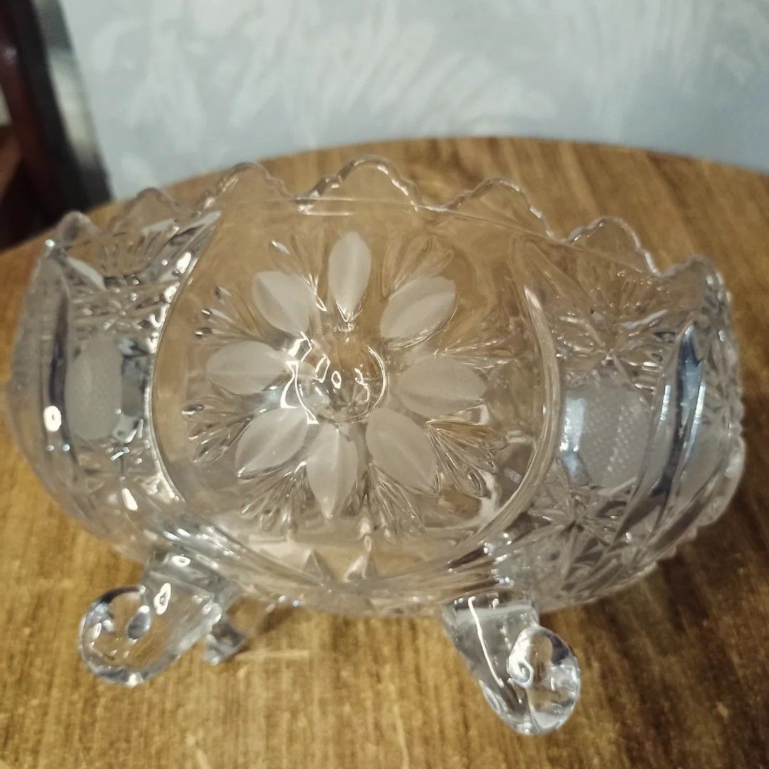 Vintage Crystal Glass Bowl (Category: Other Kitchenware & Tableware) located in Baguio. Submitted by klutter.curio (Listing ID 1407847522, Image 2). Description: - Vintage crystal glass bowl - Beautiful floral design - Intricate detailing - Supported by three small feet - Perfect for serving snacks or display - Adds vintage charm.