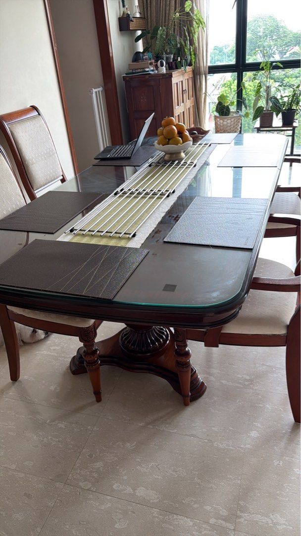 Solid Wood Dining table (Category: Tables & Sets) located in Singapore. Submitted by vd-estate-sale (Listing ID 1407851171, Image 1). Description: Can seat up to 8 pax comfortably Collapsible to six pax dining Custom glass sheet on top for scratch protection .