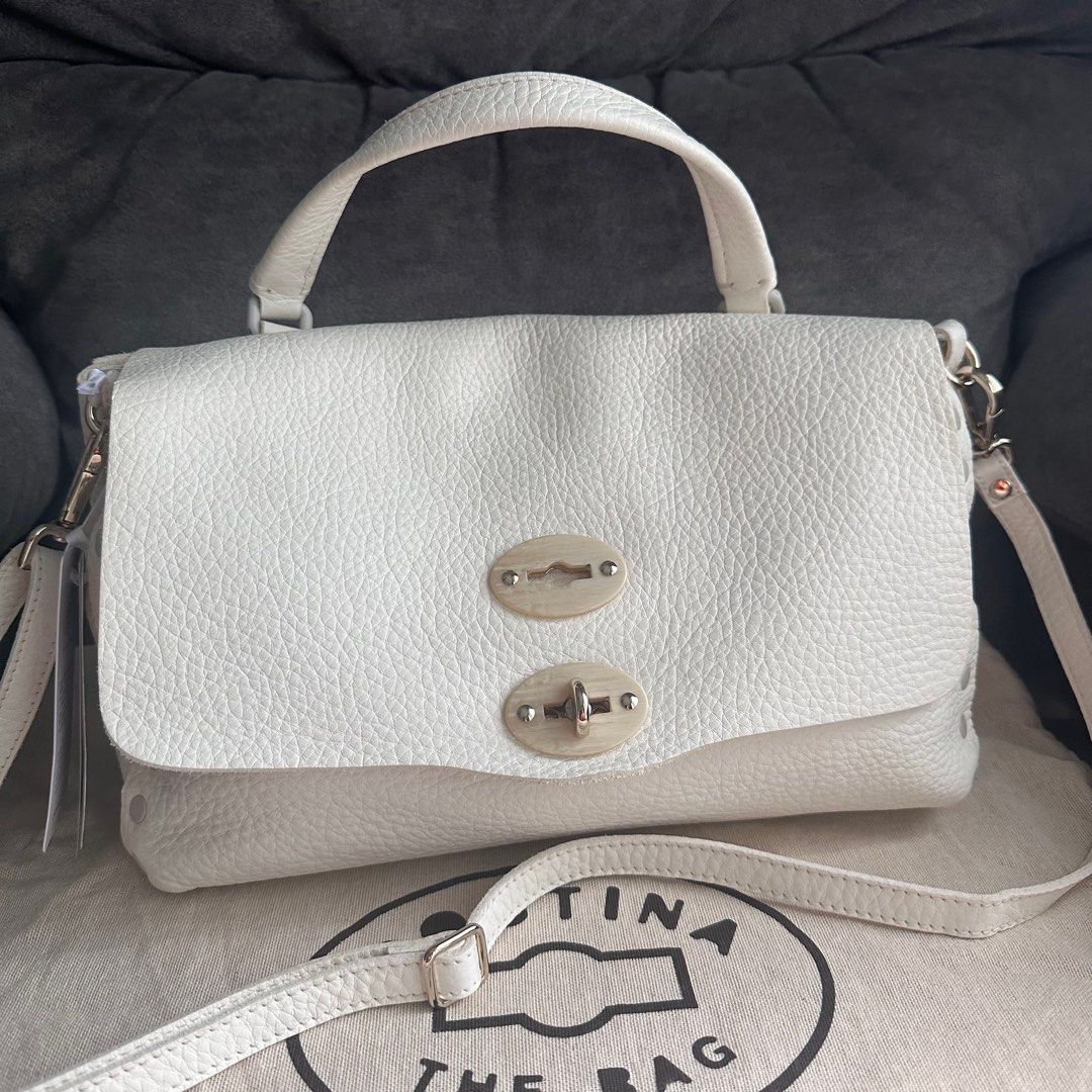 Zanellato Postina Small White (Category: Luxury Bags & Wallets) located in Antipolo. Submitted by fasph (Listing ID 1407757873, Image 1). Description: Brand new wih tags and dustbag Really pretty. Made from real leather. 29 cm wide, 20 cm high, and 15 cm deep, with a handle drop of around 7 cm. Zanellato is an italian luxury brand. This was a gift that I never got to use because I cant maintain a white bag 😅.