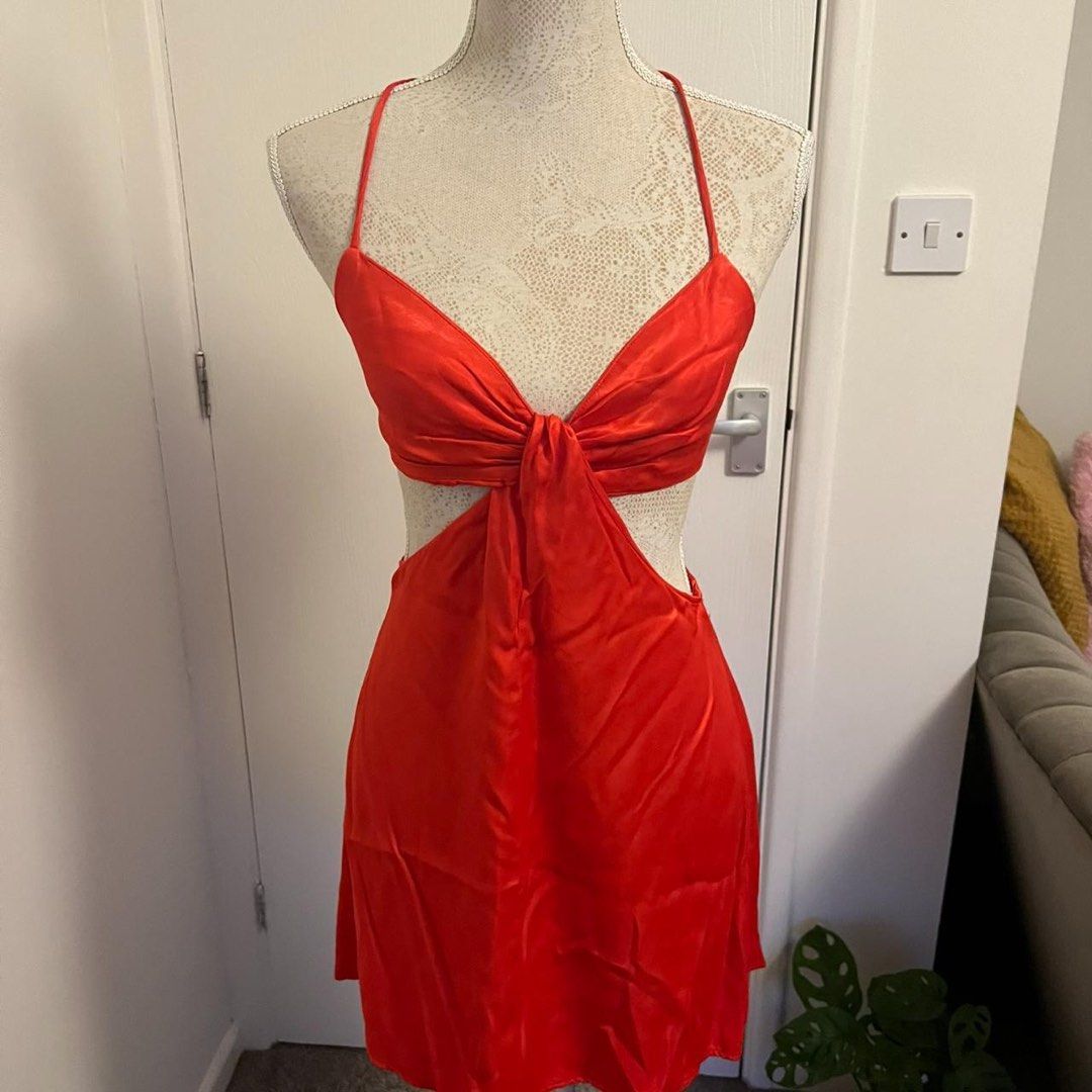 Zara Red Cut-Out Dress (Category: Dresses) located in Quezon City. Submitted by ys4bella (Listing ID 1407875545, Image 3). Description: - ORIG Zara red satin dress (used once only) - Unique cut-out design - Halter neck with bow detail - Silky material - Flattering silhouette - Size M - Perfect for a night out or special occasion.