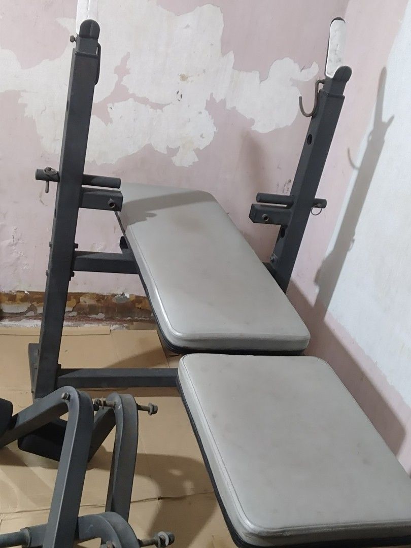 Heavy Duty Adjustable Weight Bench with Leg Extension (Category: Weights & Dumbbells) located in Quezon City. Submitted by racketero (Listing ID 1408073197, Image 1). Description: Adjustable weight bench is perfect for home workouts. It features a bench with back and seat pads, a leg extension attachment, and barbell supports. The bench is adjustable to different angles for various exercises. Includes all the parts shown in the images..