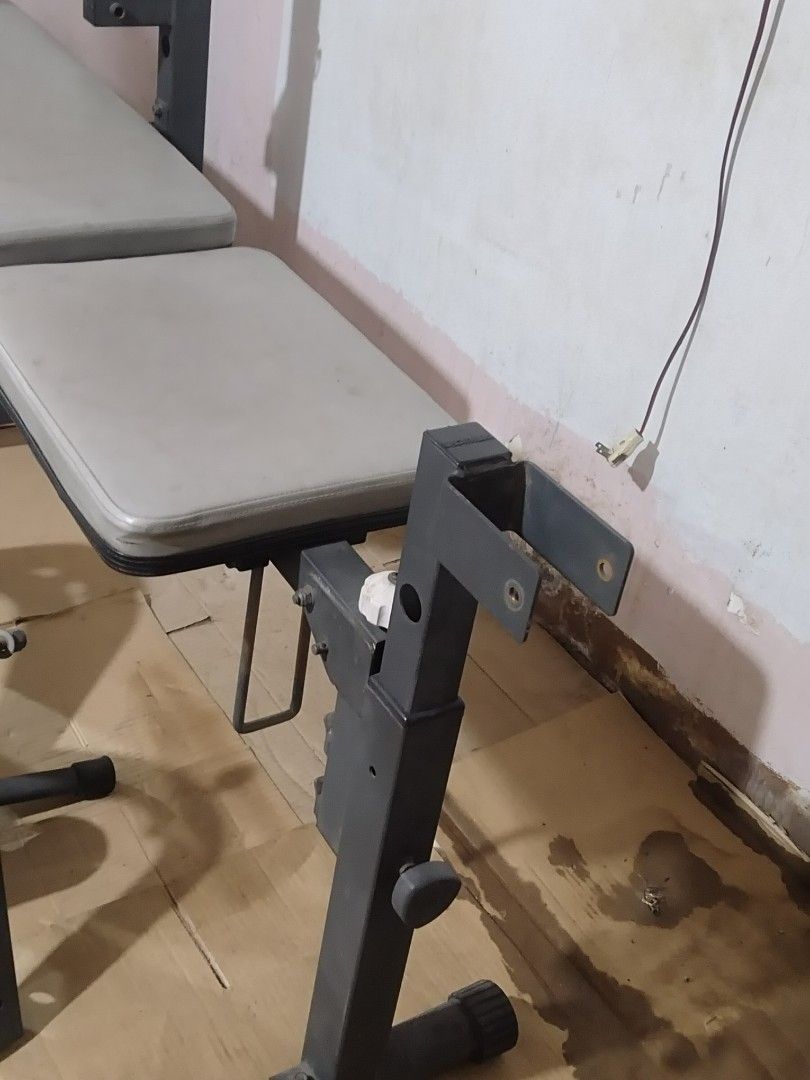 Heavy Duty Adjustable Weight Bench with Leg Extension (Category: Weights & Dumbbells) located in Quezon City. Submitted by racketero (Listing ID 1408073197, Image 3). Description: Adjustable weight bench is perfect for home workouts. It features a bench with back and seat pads, a leg extension attachment, and barbell supports. The bench is adjustable to different angles for various exercises. Includes all the parts shown in the images..