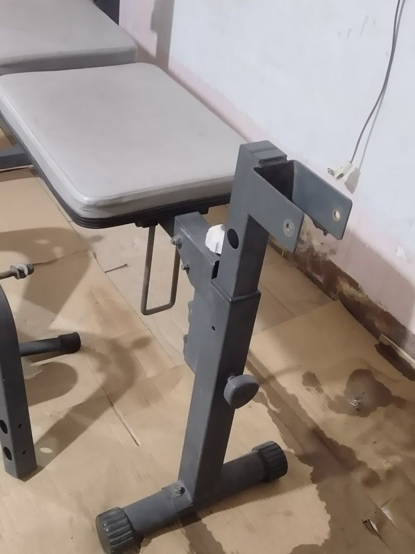 Heavy Duty Adjustable Weight Bench with Leg Extension (Category: Weights & Dumbbells) located in Quezon City. Submitted by racketero (Listing ID 1408073197, Image 2). Description: Adjustable weight bench is perfect for home workouts. It features a bench with back and seat pads, a leg extension attachment, and barbell supports. The bench is adjustable to different angles for various exercises. Includes all the parts shown in the images..