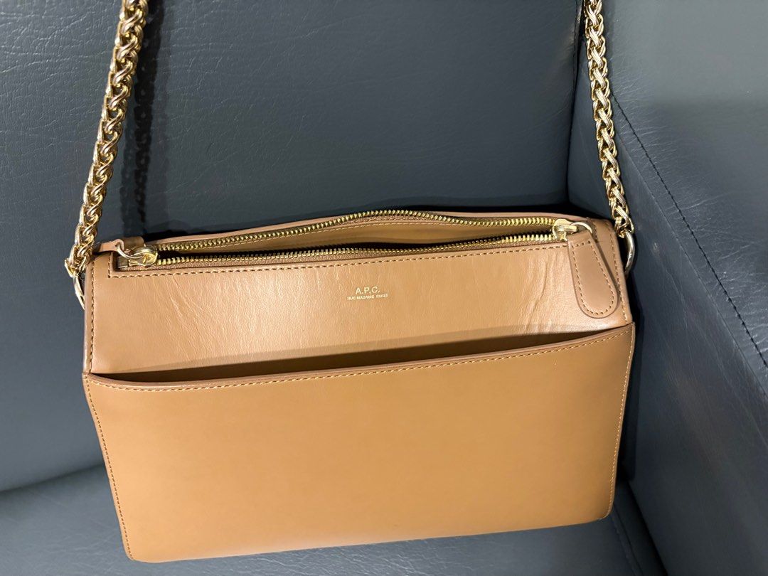 APC Ella (Category: Luxury Bags & Wallets) located in Quezon City. Submitted by lastshopsyndrome (Listing ID 1408112351, Image 2). Description: RUSH SALE - APC Ella - Gold chain strap - Front pocket - Top zipper closure - APC logo on the front - Rectangular shape - Complete tags and dust bag - RFS not used as much and need funds.