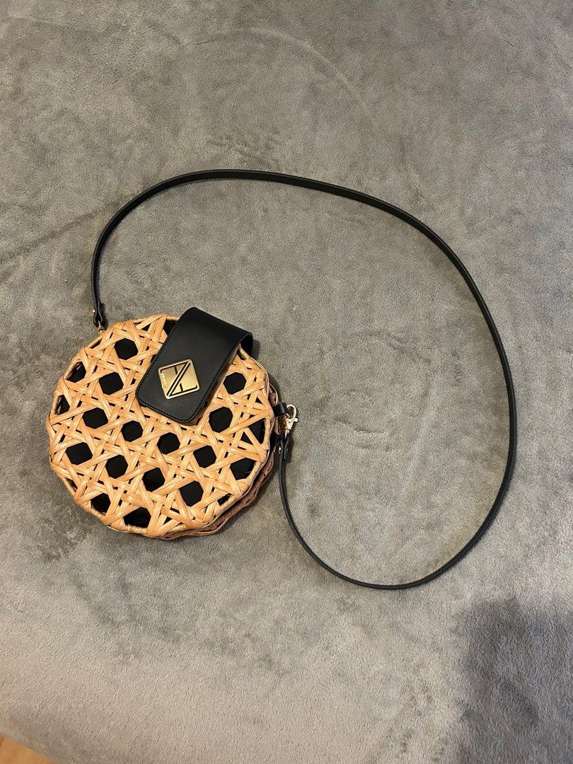 Aranaz Round Woven Handbag with Black Strap (Category: Shoulder Bags) located in Taguig. Submitted by _wardrobecleanse (Listing ID 1408025258, Image 1). Description: Used ONCE only - Round handbag with woven design - Black flap and adjustable strap - Black interior - Magnetic closure - Gold-colored logo - limited so only a few people have it.