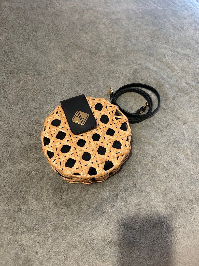Aranaz Round Woven Handbag with Black Strap (Category: Shoulder Bags) located in Taguig. Submitted by _wardrobecleanse (Listing ID 1408025258, Image 2). Description: Used ONCE only - Round handbag with woven design - Black flap and adjustable strap - Black interior - Magnetic closure - Gold-colored logo - limited so only a few people have it.