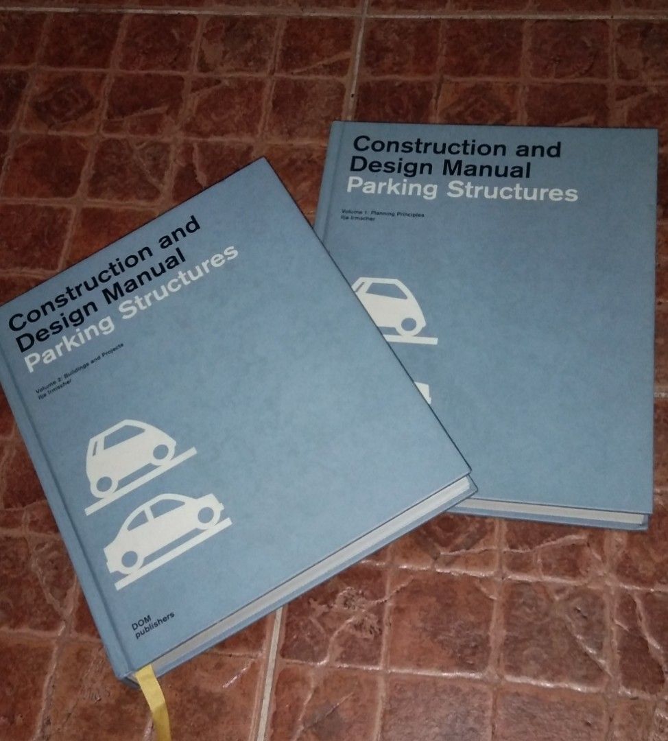 Architects' Construction and Design Manual Parking Structures (Category: Textbooks) located in Quezon City. Submitted by dancatz (Listing ID 1408106087, Image 1). Description: - Two-book set: "Construction and Design Manual Parking Structures" by DOM Publishers. - Features detailed information on parking structure design. - Includes diagrams, architectural designs, and illustrations. - Filled with architectural plans. - One book has a signature o