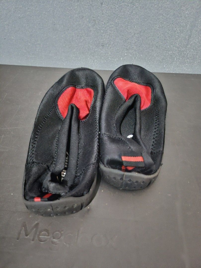 Black and Red Water Shoes size 10 (Category: Heels) located in Angeles City. Submitted by buxom.cheeks (Listing ID 1408017465, Image 3). Description: - Black water shoes with red mesh accent - Slip-on design for easy wear - Features a pull tab at the heel - Durable black rubber soles - Designed for water activities - Comfortable fit.