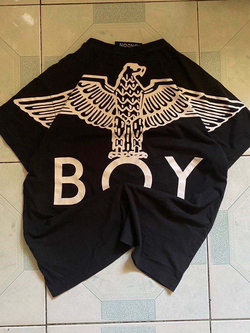 Boy London Black T-shirt (Category: Tshirts & Polo Shirts ) located in Manila. Submitted by marcuniverse (Listing ID 1408035679, Image 2). Description: - Black Boy London T-shirt - Henley collar with buttons - Short sleeves - Features the Boy London logo on the front and back - Large eagle design on the back - Made of cotton.