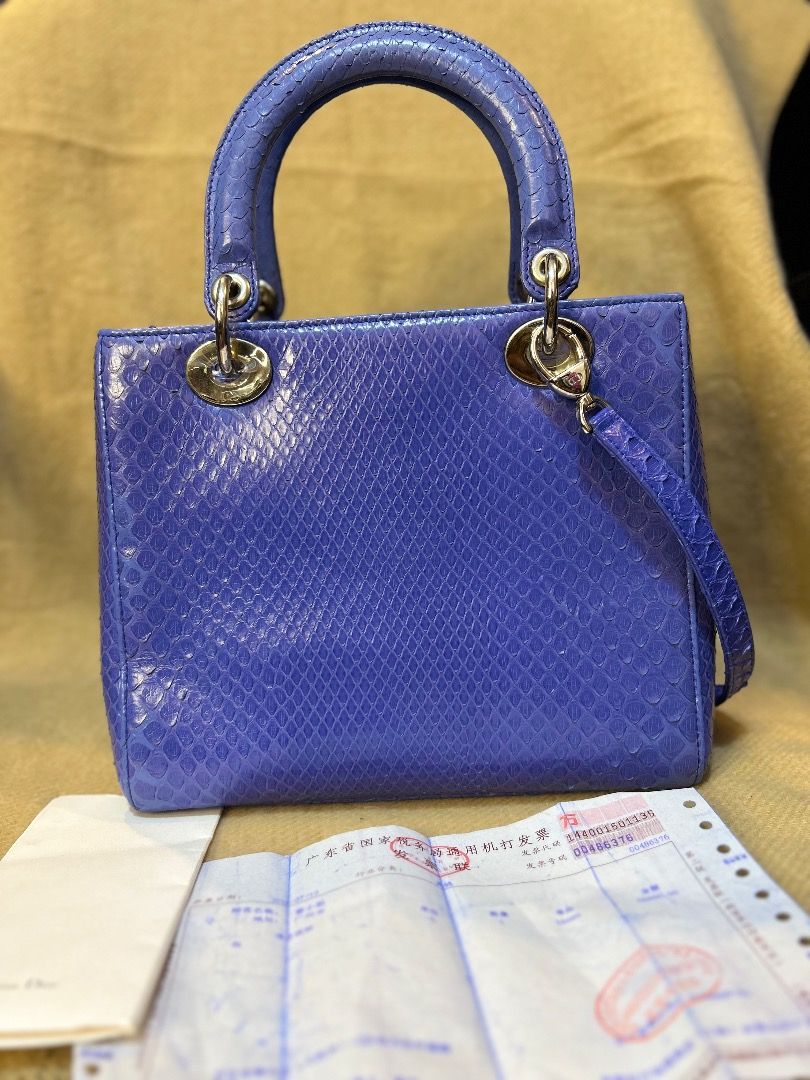 Christian Dior Lady Dior Python Handbag (Category: Luxury Bags & Wallets) located in Caloocan City. Submitted by piamariemo11606 (Listing ID 1408065676, Image 3). Description: - Authentic Lady Dior handbag - Stunning blue python leather - Includes original Christian Dior card and receipt - Silver-tone hardware - Iconic Dior charms - Top handle and detachable shoulder strap.