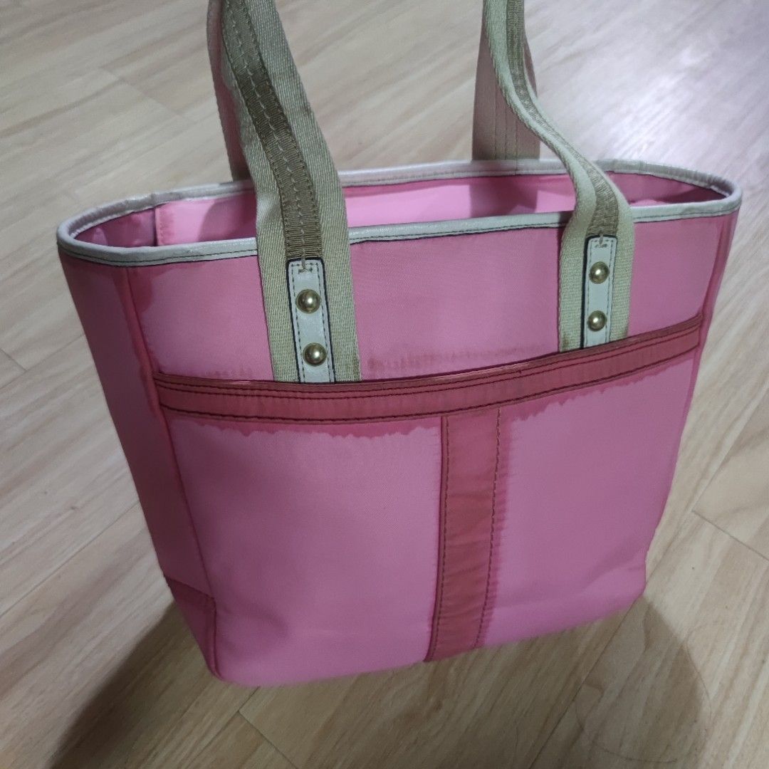 Coach Hampton Weekend Pink Satin Tote Bag (Category: Luxury Bags & Wallets) located in Dagupan City. Submitted by jhazrightshop (Listing ID 1408093894, Image 2). Description: - Authentic Coach tote bag - Zip closure - Pink interior with multiple compartments - Small zip pocket inside ❌ prang may stain . .
