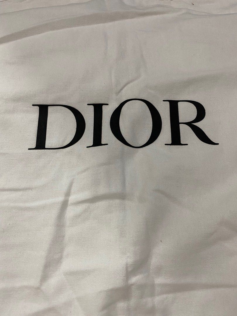Dior Garment Bag (Category: Luxury Bags & Wallets) located in Manila. Submitted by angeliemataro25 (Listing ID 1407966176, Image 1). Description: - Authentic Dior garment bag - Features the classic Dior logo - Convenient zipper closure - Includes a handle for easy carrying - Dimensions: Approximately 64" length x 24" width - Ideal for travel or storage.