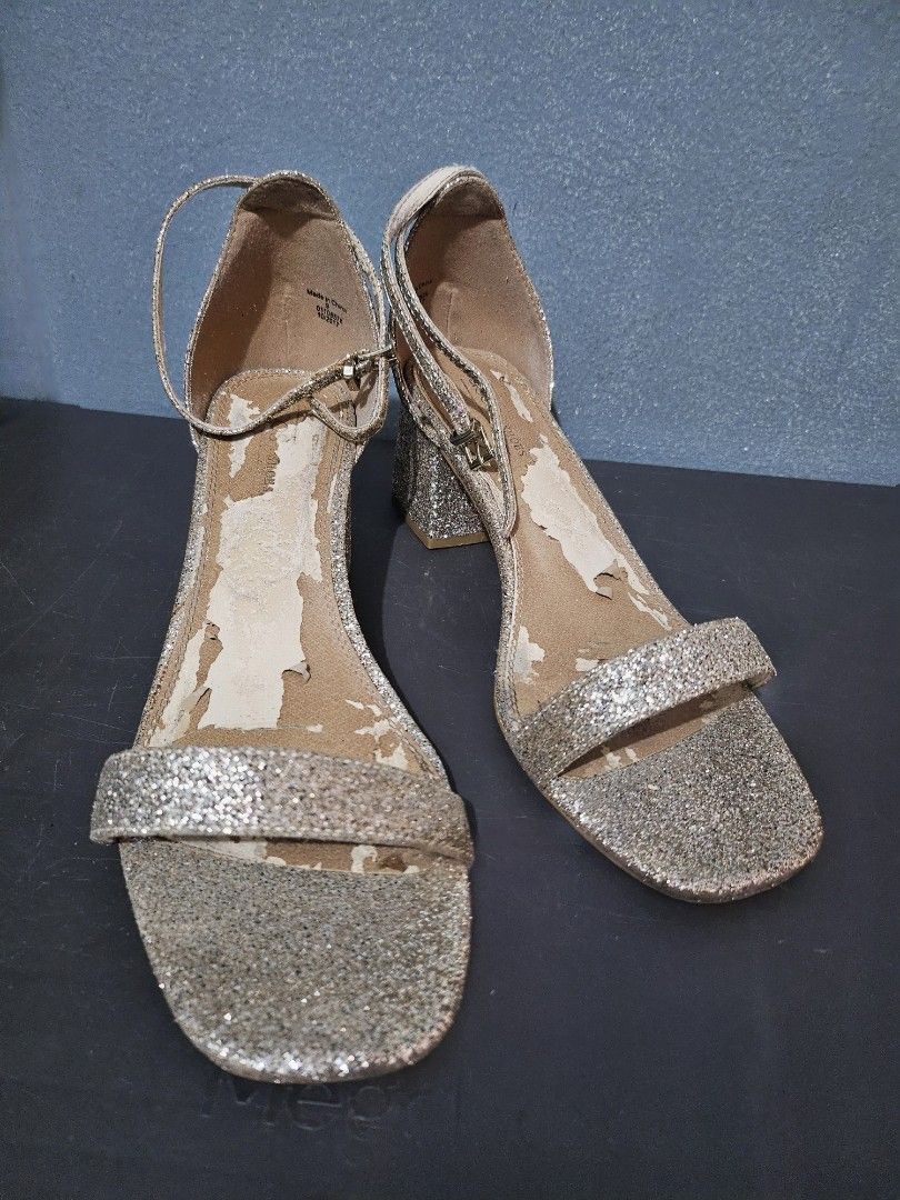 B2T1 Glittery Block Heel Sandals size 11 (Category: Heels) located in Angeles City. Submitted by buxom.cheeks (Listing ID 1408017104, Image 1). Description: - Glitter block heel sandals - Ankle strap design - Single toe strap - Neutral color (gold/silver) - Signs of wear on insole - Glitter-covered heels.