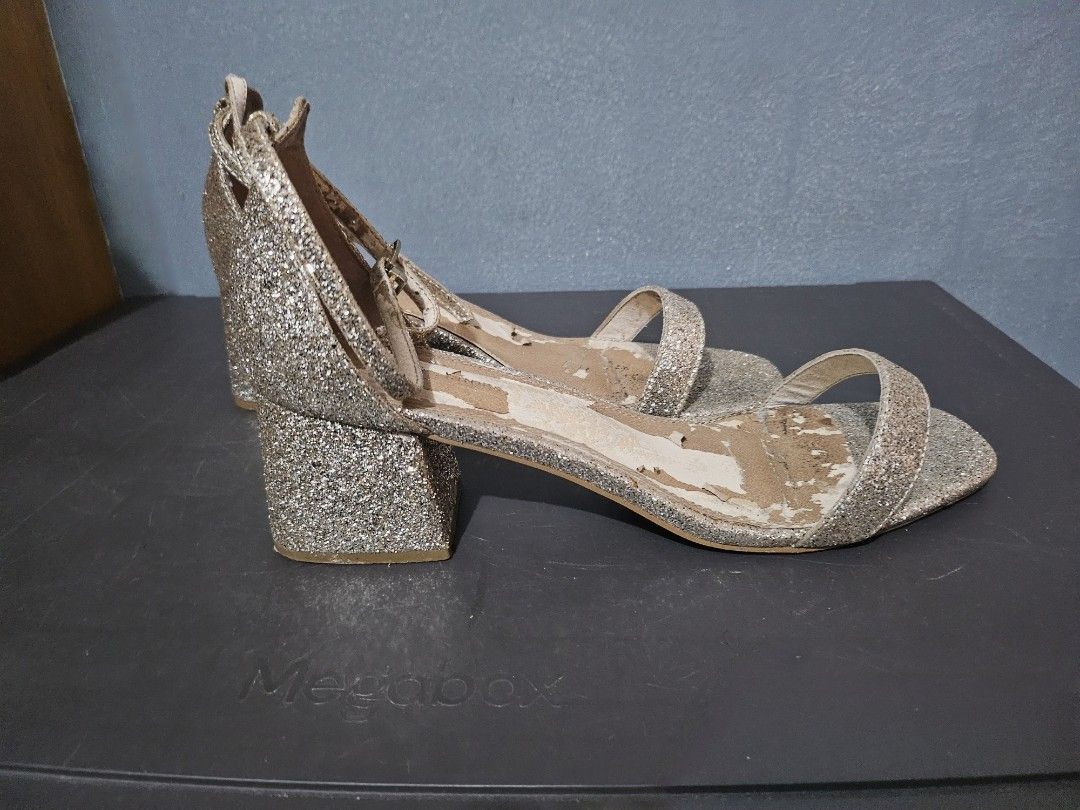 B2T1 Glittery Block Heel Sandals size 11 (Category: Heels) located in Angeles City. Submitted by buxom.cheeks (Listing ID 1408017104, Image 2). Description: - Glitter block heel sandals - Ankle strap design - Single toe strap - Neutral color (gold/silver) - Signs of wear on insole - Glitter-covered heels.