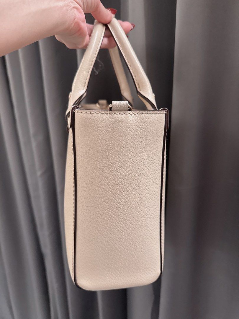 Kate Spade Wellesley Small Quinn Bag (Category: Luxury Bags & Wallets) located in Lucena. Submitted by fashioncult.ph (Listing ID 1407992149, Image 2). Description: - white Kate Spade handbag - Structured design - Dual top handles - Detachable shoulder strap - Pink fabric interior - Interior zippered pocket - Rectangular shape - Metal Kate Spade logo.