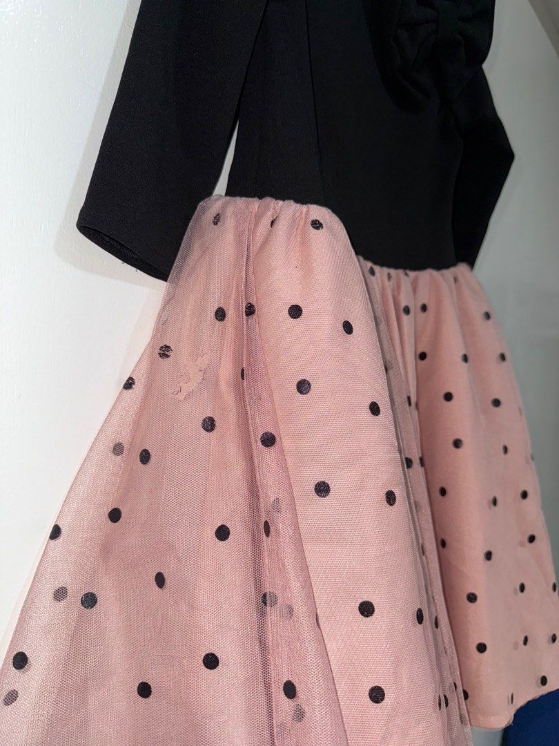 Laila & Lyra Polka Dot Dress (Category: Babies & Kids Fashion) located in Manila. Submitted by angz12 (Listing ID 1407988774, Image 3). Description: Adorable dress featuring a black bodice with a bow detail and long sleeves. The skirt is a lovely pink with black polka dots. The dress has a tulle overlay for added flair. The back of the dress has a criss-cross design. Perfect for special occasions or everyday wear. May slight na butas pero di nman