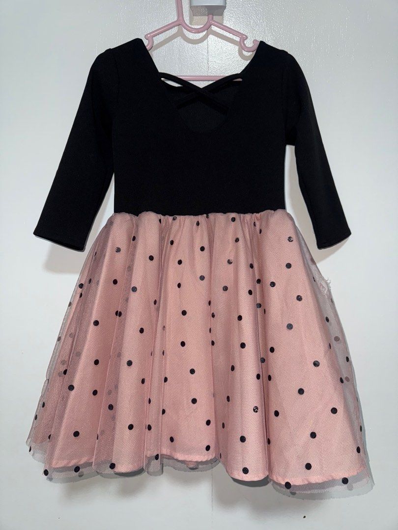 Laila & Lyra Polka Dot Dress (Category: Babies & Kids Fashion) located in Manila. Submitted by angz12 (Listing ID 1407988774, Image 2). Description: Adorable dress featuring a black bodice with a bow detail and long sleeves. The skirt is a lovely pink with black polka dots. The dress has a tulle overlay for added flair. The back of the dress has a criss-cross design. Perfect for special occasions or everyday wear. May slight na butas pero di nman