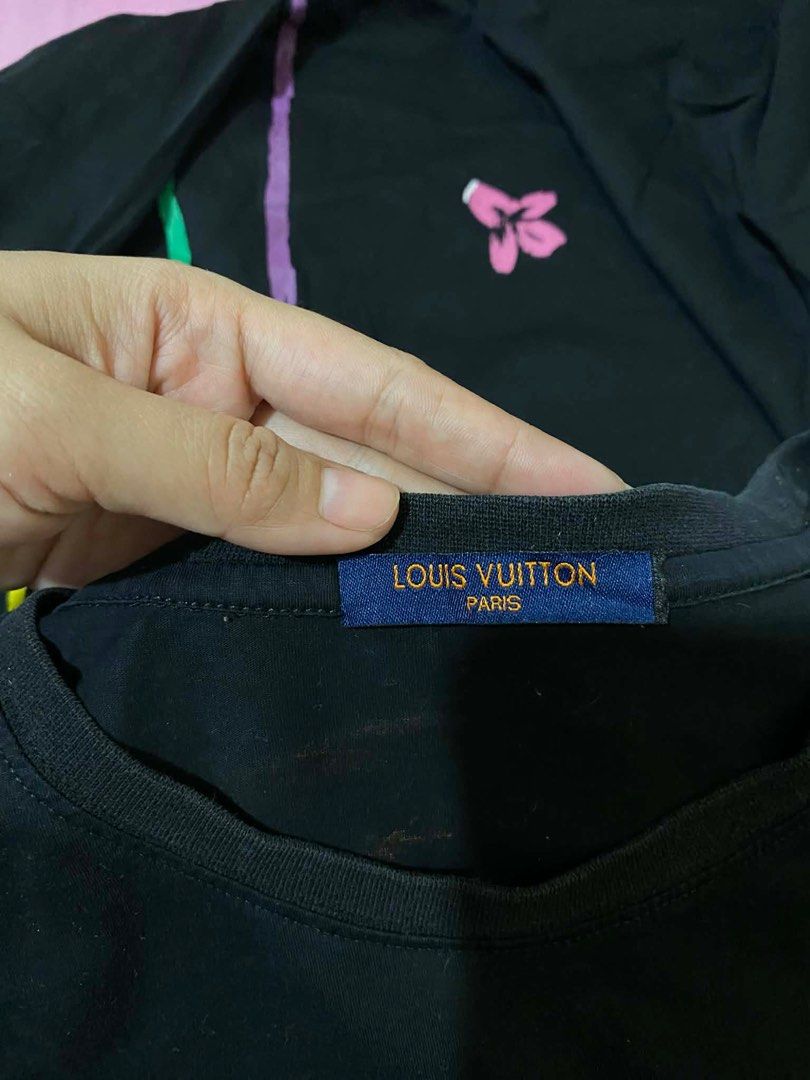 Louis Vuitton Long Sleeve T-shirt (Category: Tshirts & Polo Shirts ) located in Caloocan City. Submitted by mrknll (Listing ID 1408032267, Image 3). Description: - Louis Vuitton black long sleeve shirt - Size: L - Features a colorful graphic on the front - Rainbow design with text on the back - Made in Japan.