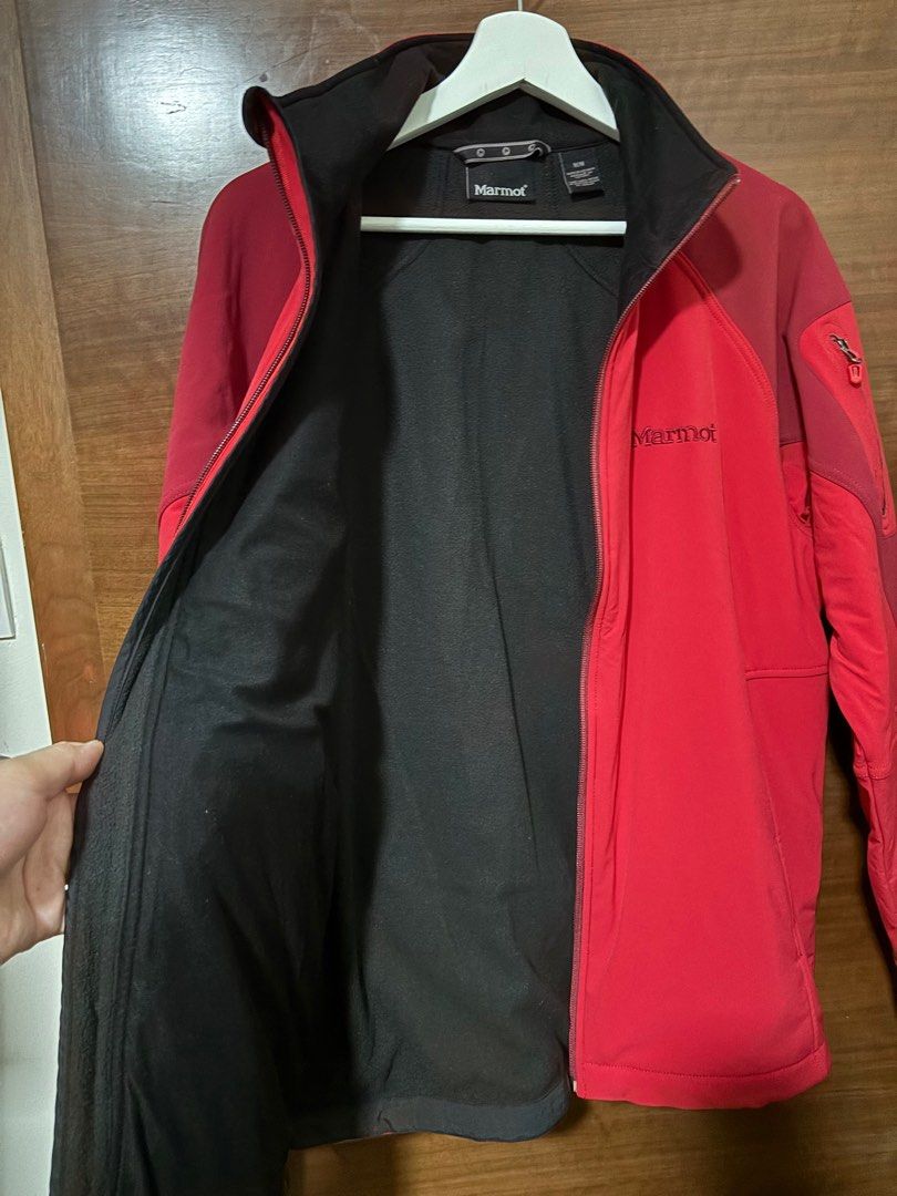 Marmot Softshell Jacket - Medium (Category: Coats, Jackets and Outerwear) located in Singapore. Submitted by seoul_out (Listing ID 1407973146, Image 2). Description: authentic excellent condition inner softshell for snow ski or climbing - Vibrant red exterior - Black interior lining - Size: M/M - multiple pockets with zip-up left arm sleeves pair with blue ski/outdoor pants as set ($150).
