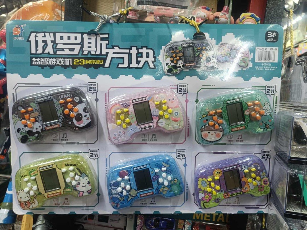 Mini Brick Game Console 23 Games (Category: Nintendo) located in Manila. Submitted by agaton_clariza10 (Listing ID 1407953485, Image 1). Description: - 23 built-in games - Small screen and colorful buttons - Available designs: Panda, Bunny, Flower - Suitable for ages 3+ - Requires 2 AAA batteries.