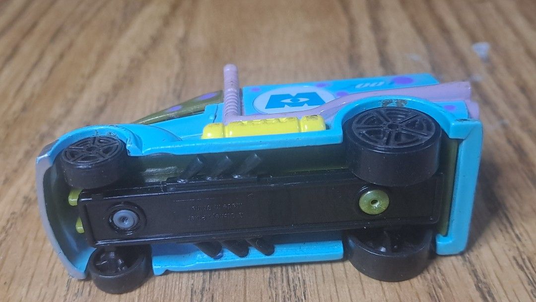 Monsters Inc. Truck Toy (Category: Vehicle & Diecast Models) located in Davao. Submitted by bravemoon_556cd5 (Listing ID 1408027955, Image 3). Description: - Monsters, Inc. themed toy truck - Diecast metal and plastic construction - Light blue body with purple polka dots - Green top - Black wheels - Features the Monsters, Inc. logo - Includes the number "2001".