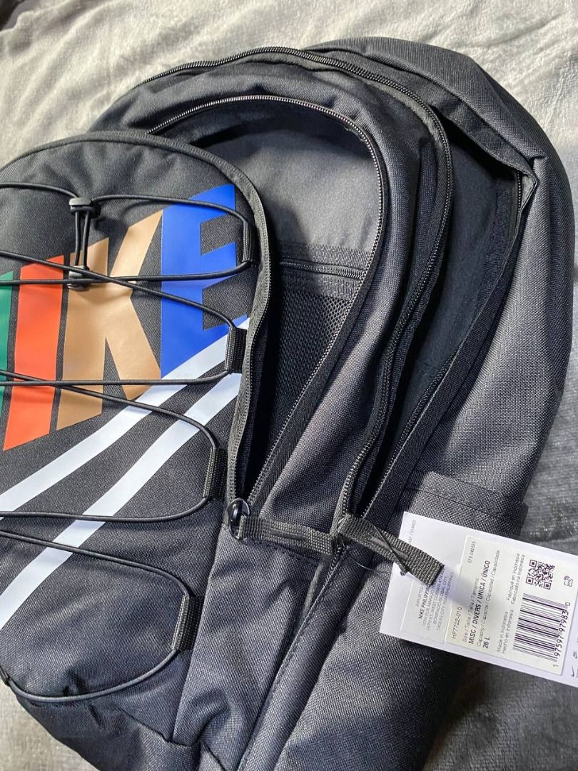 Brand New Nike Hayward Backpack 26L (Category: Backpacks) located in Valenzuela. Submitted by emg.everythingmustgo (Listing ID 1408077527, Image 3). Description: - Nike backpack with a large white logo and colorful design. - Main compartment for storage. - Front and side pockets for extra space. - Adjustable straps for a comfortable fit. - Includes a small logo on the back. - Comes with a tag attached. Original SRP 3,295.