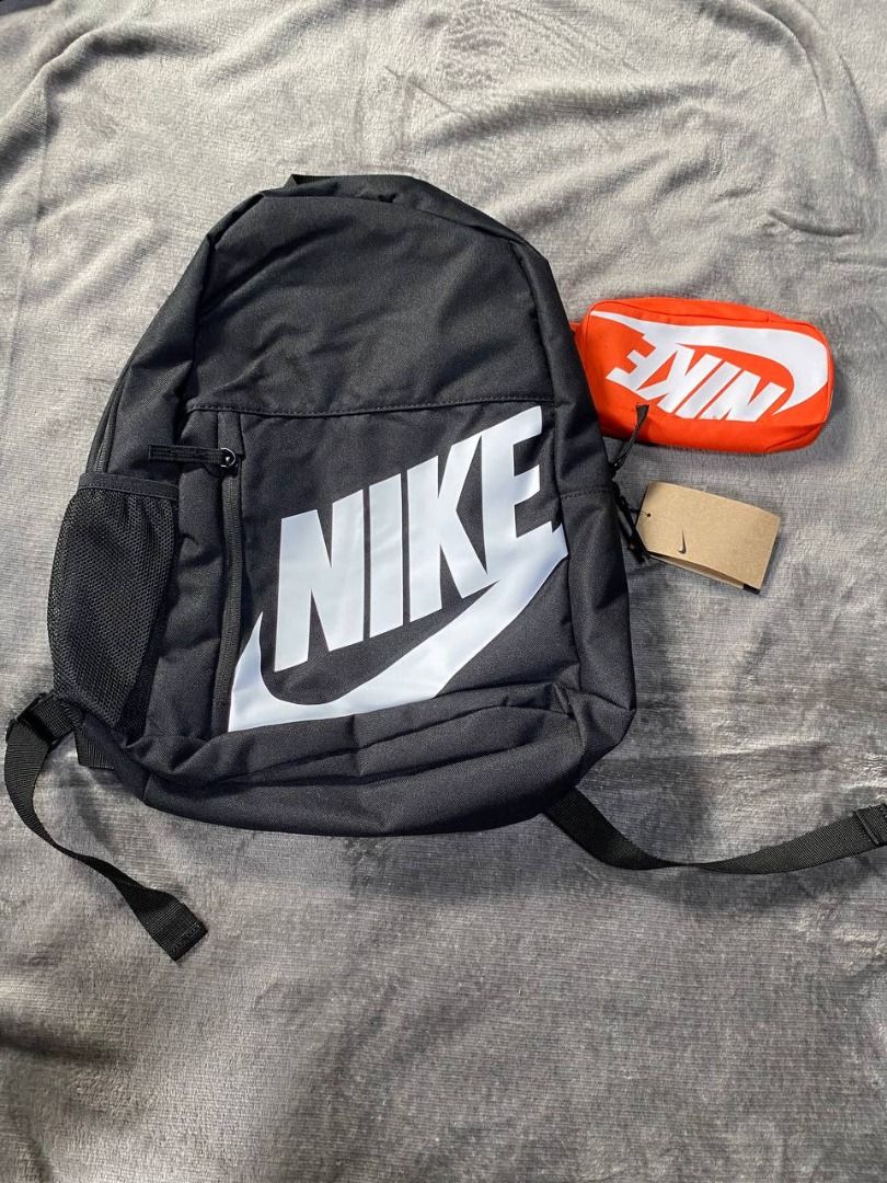 Brand New Nike Black Backpack 20L (Category: Backpacks) located in Valenzuela. Submitted by emg.everythingmustgo (Listing ID 1408077097, Image 1). Description: - Nike Black Backpack, 20L capacity. - Features the iconic Nike logo. - Classic black color for versatile use. - Includes a bonus orange pouch. - Side pocket for water bottle. Original SRP 1,695.