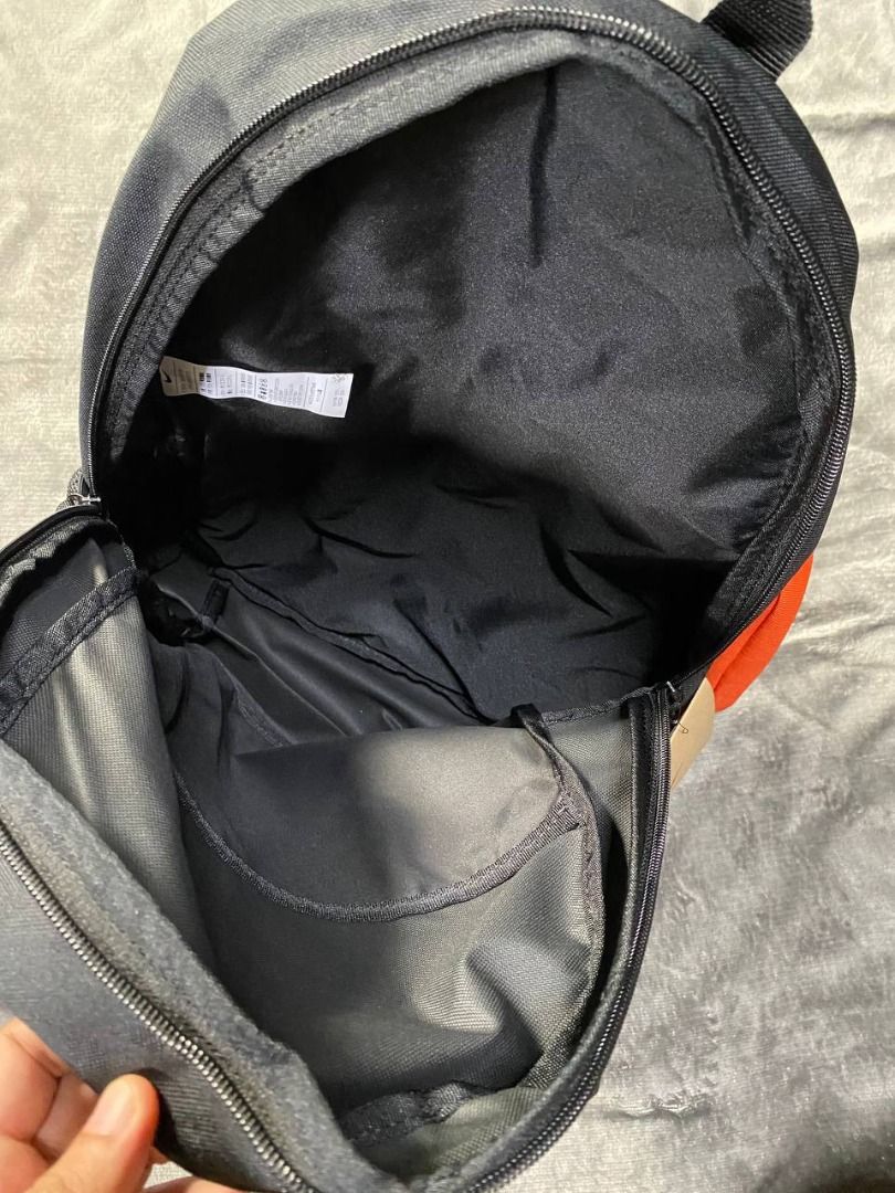 Brand New Nike Black Backpack 20L (Category: Backpacks) located in Valenzuela. Submitted by emg.everythingmustgo (Listing ID 1408077097, Image 3). Description: - Nike Black Backpack, 20L capacity. - Features the iconic Nike logo. - Classic black color for versatile use. - Includes a bonus orange pouch. - Side pocket for water bottle. Original SRP 1,695.