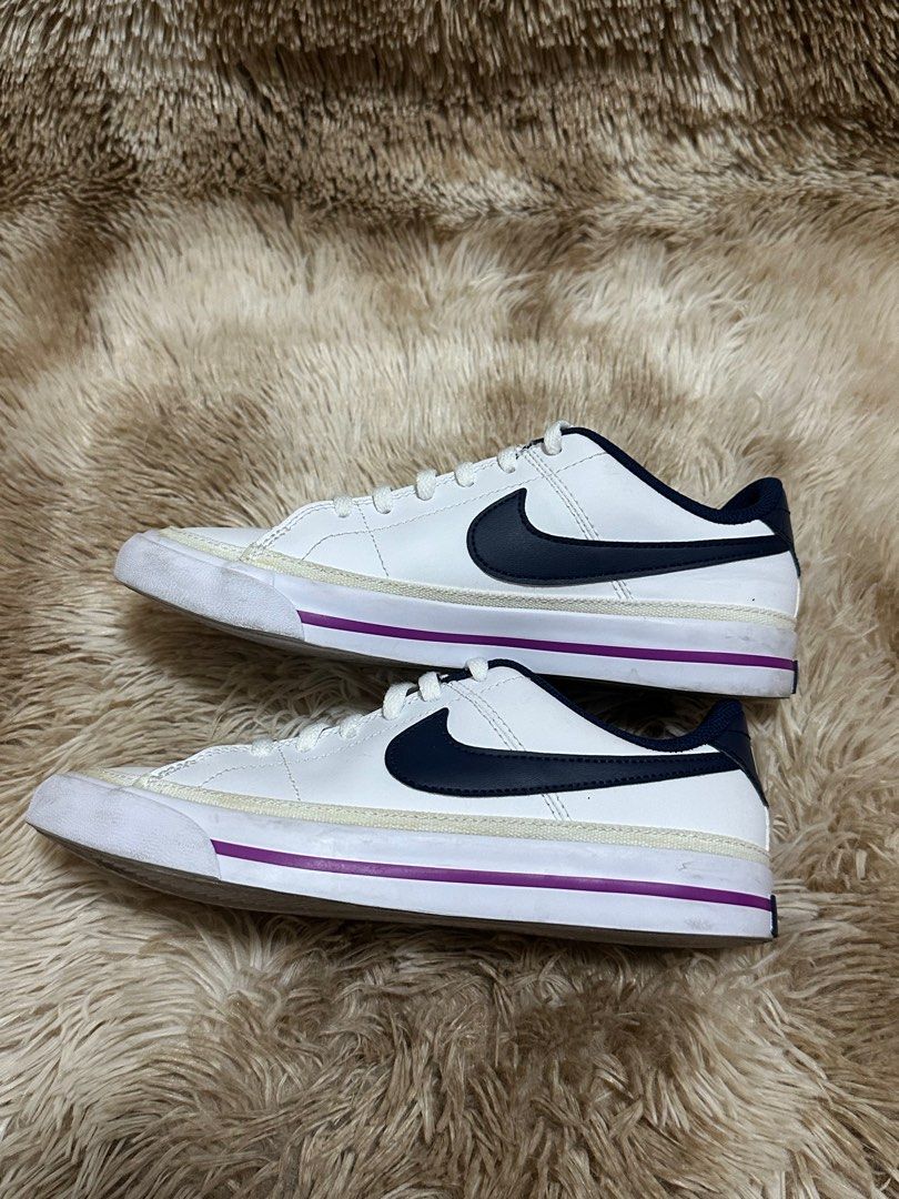 Nike Court Legacy (GS) (Category: Babies & Kids Fashion) located in Cainta. Submitted by kath_pl (Listing ID 1407950758, Image 3). Description: - Nike Court Legacy (GS) sneakers - Color: White with navy accents - Features a navy swoosh and purple sole stripe - Size: 4Y (UK 3.5, CM 23) - Made in Vietnam - Condition: Good.