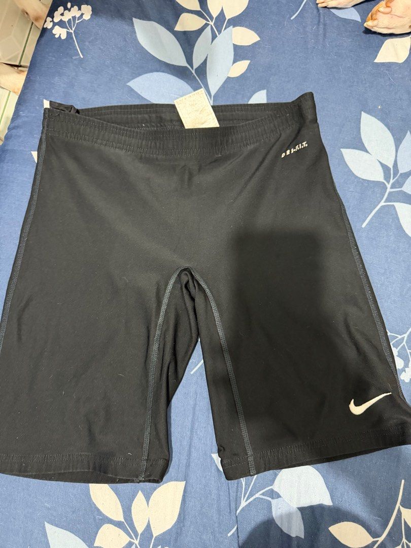 Nike Dri-FIT Biker Shorts (Category: Activewear) located in Quezon City. Submitted by danii_03 (Listing ID 1407984416, Image 1). Description: - Nike Dri-FIT compression shorts - Black color - Nike logo on leg - Dri-FIT technology for moisture-wicking - Comfortable elastic waistband - Designed for athletic activities.