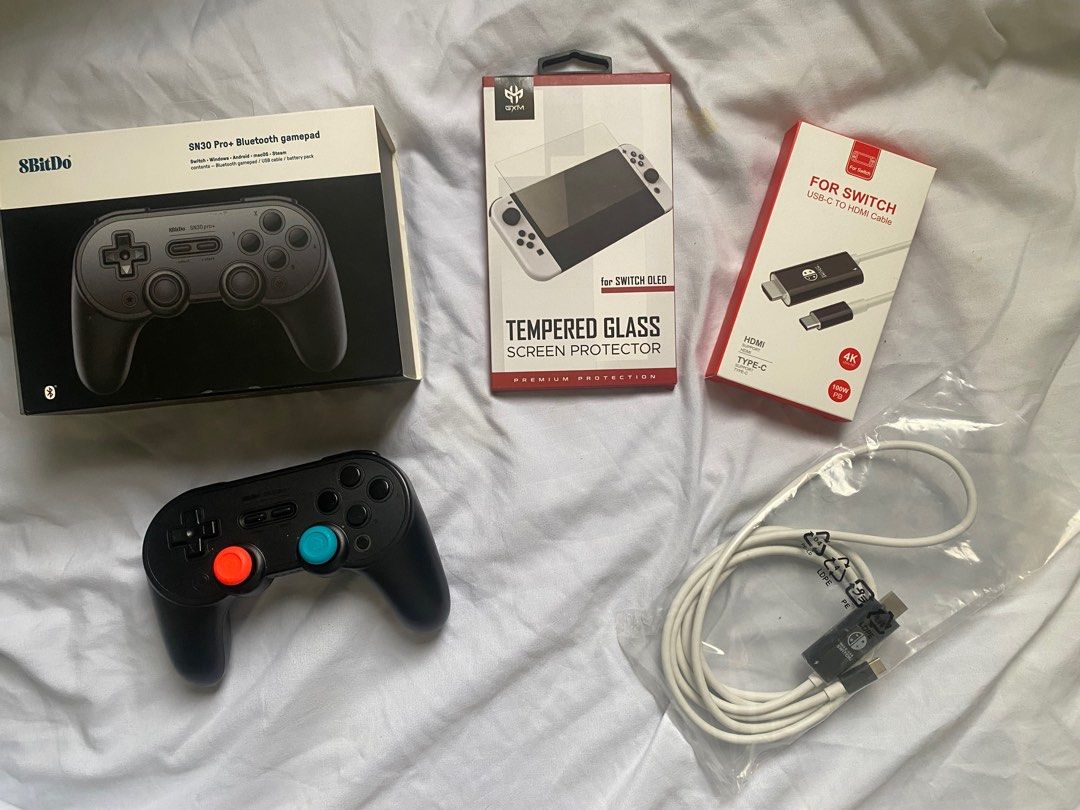 Nintendo Switch Accessories for Sale (Category: Controllers) located in Iloilo. Submitted by TheKinfolkGarage (Listing ID 1408015606, Image 1). Description: Nintendo Switch Accessories for Sale 8BitDo SN30 Pro Bluetooth gamepad - 1,500 Unused Tempered glass screen protector for Switch OLED - 150 USB-C to HDMI cable for Switch - 250.